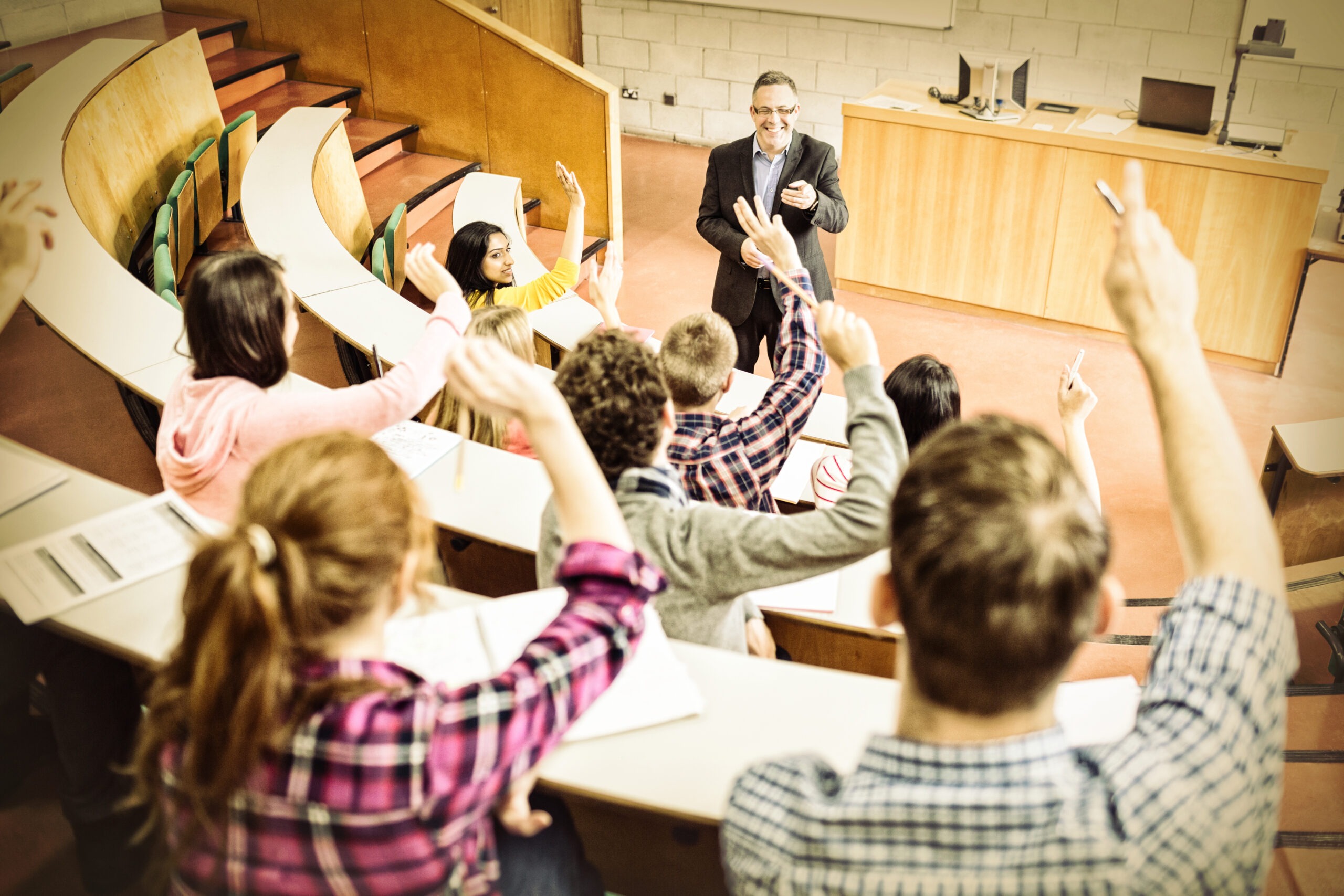 Teacher happily point to a student